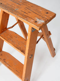 vintage orange wooden step ladder