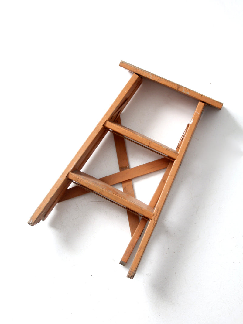 vintage orange wooden step ladder