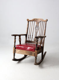 antique wooden rocking chair with upholstered seat