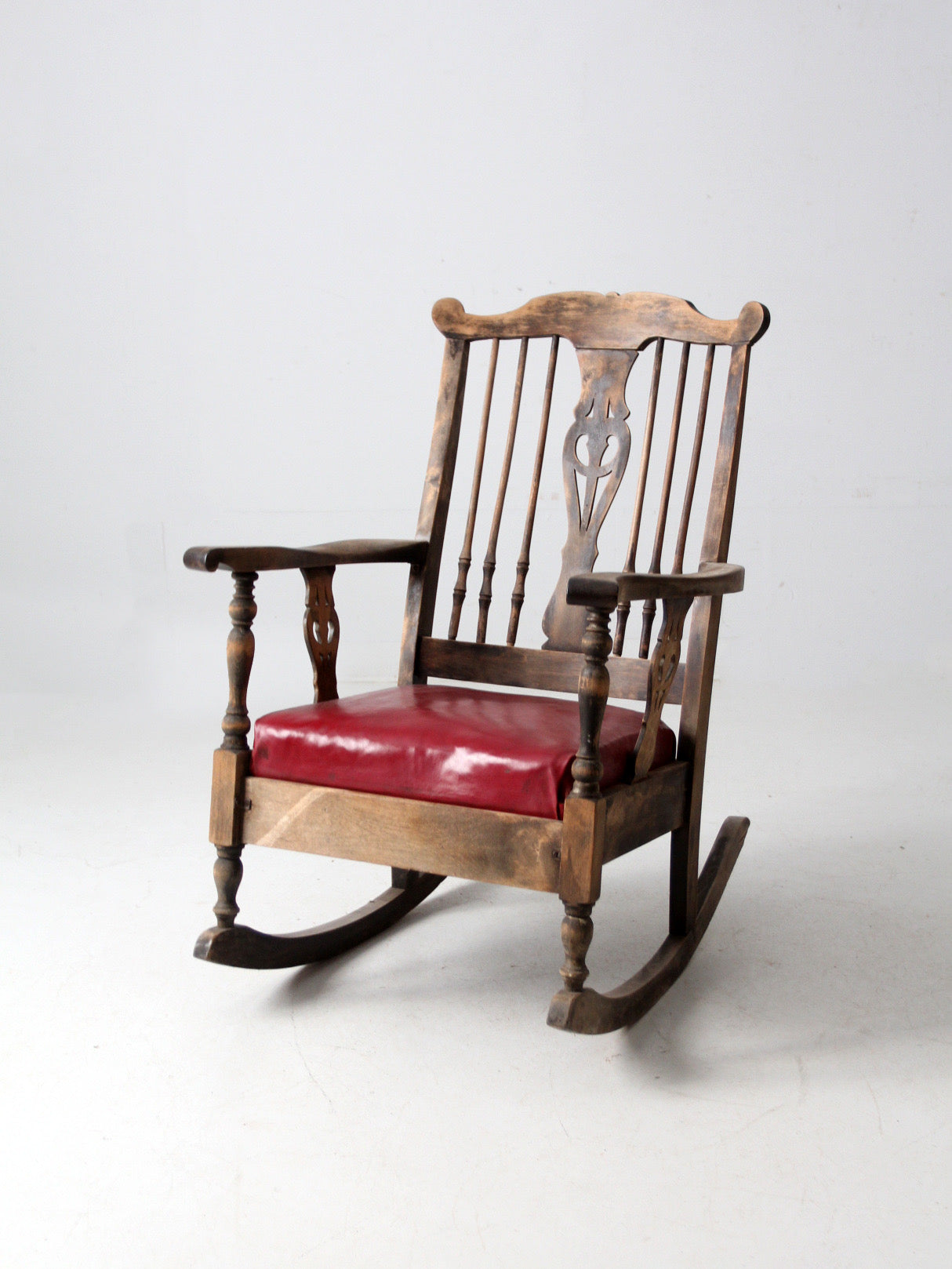 antique wooden rocking chair with upholstered seat