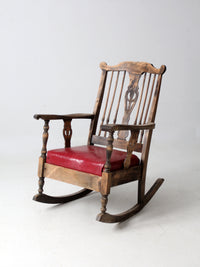 antique wooden rocking chair with upholstered seat