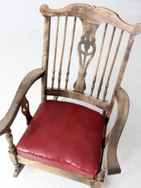 antique wooden rocking chair with upholstered seat