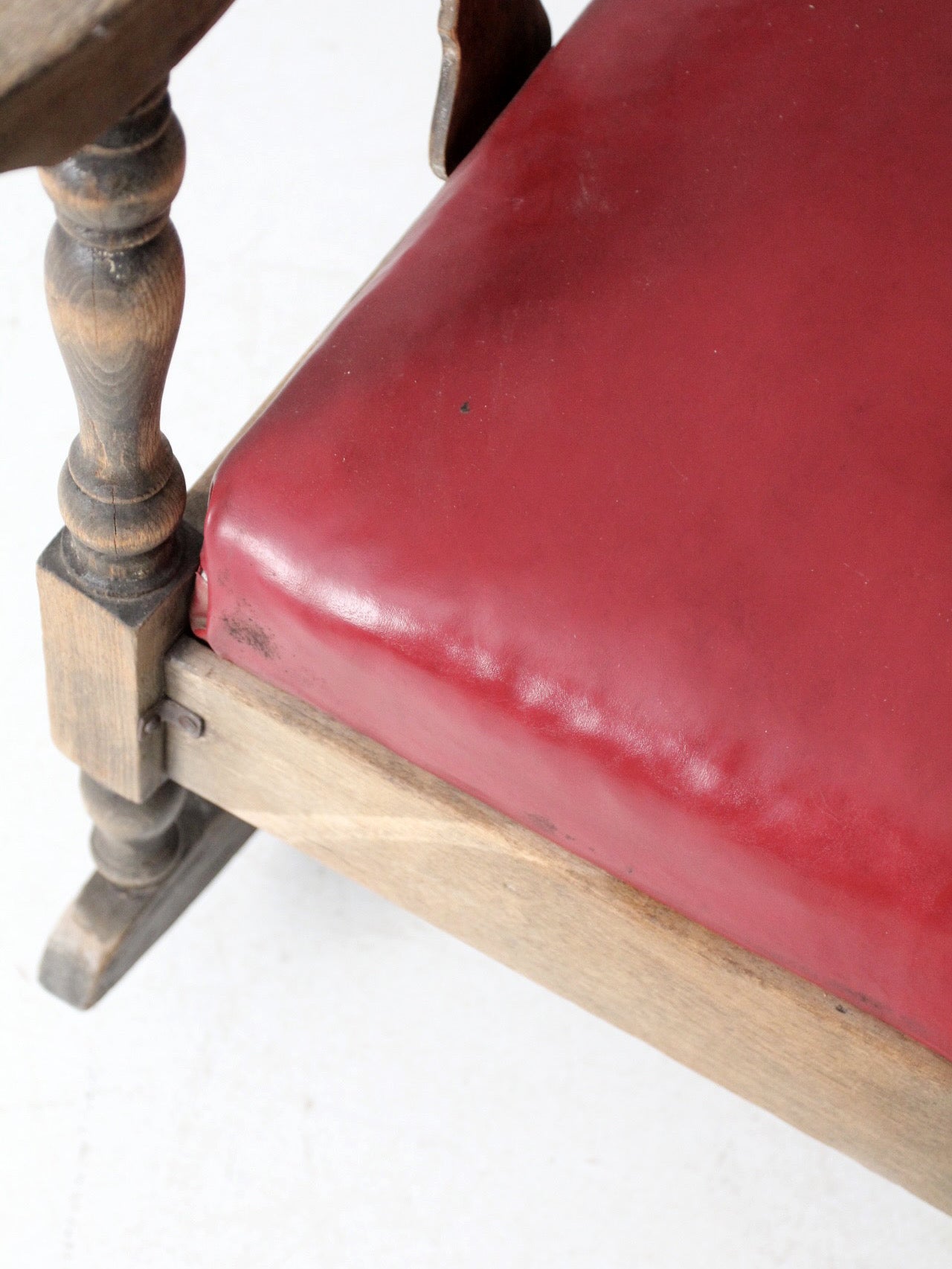 antique wooden rocking chair with upholstered seat