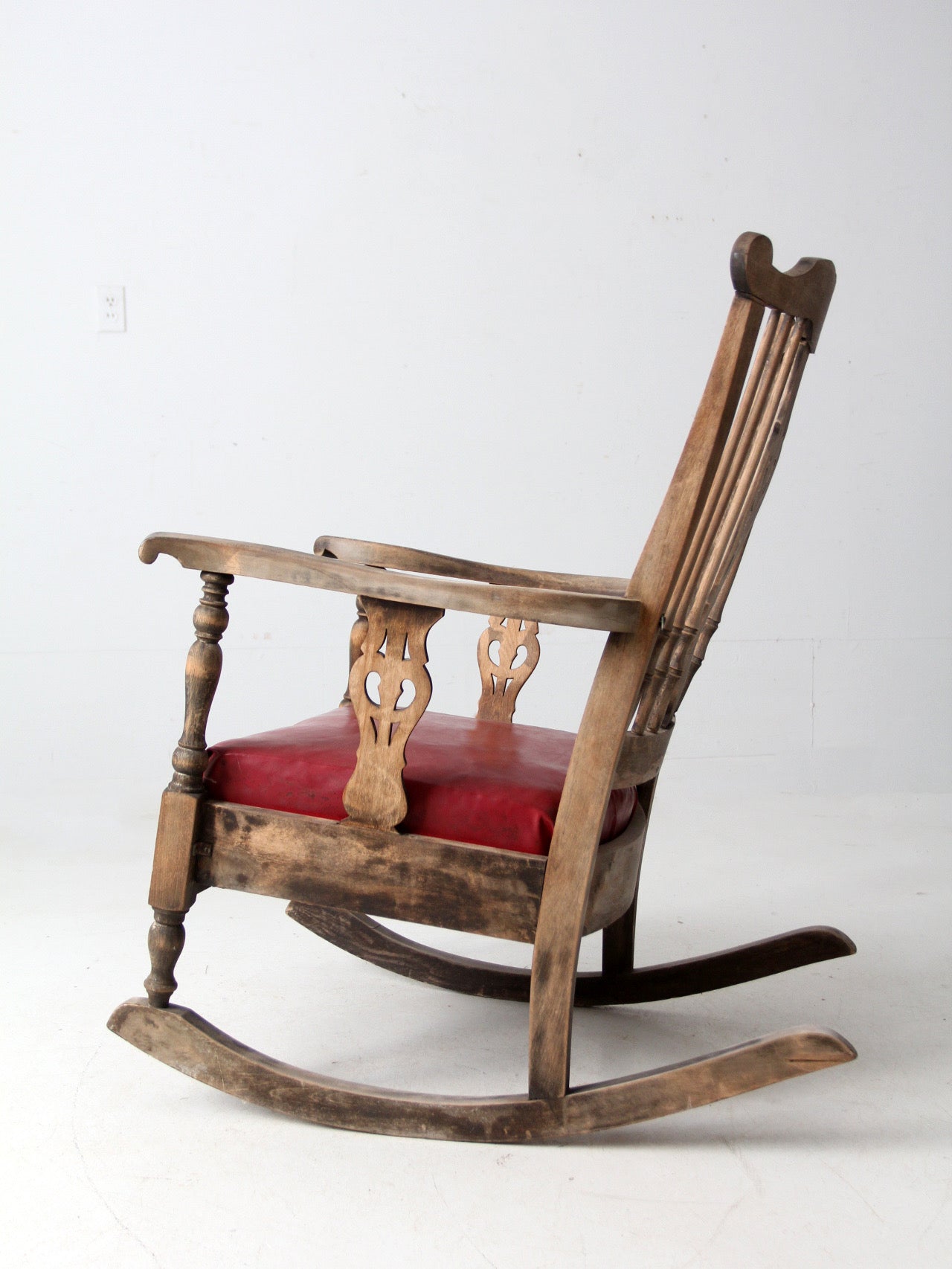 antique wooden rocking chair with upholstered seat