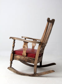 antique wooden rocking chair with upholstered seat