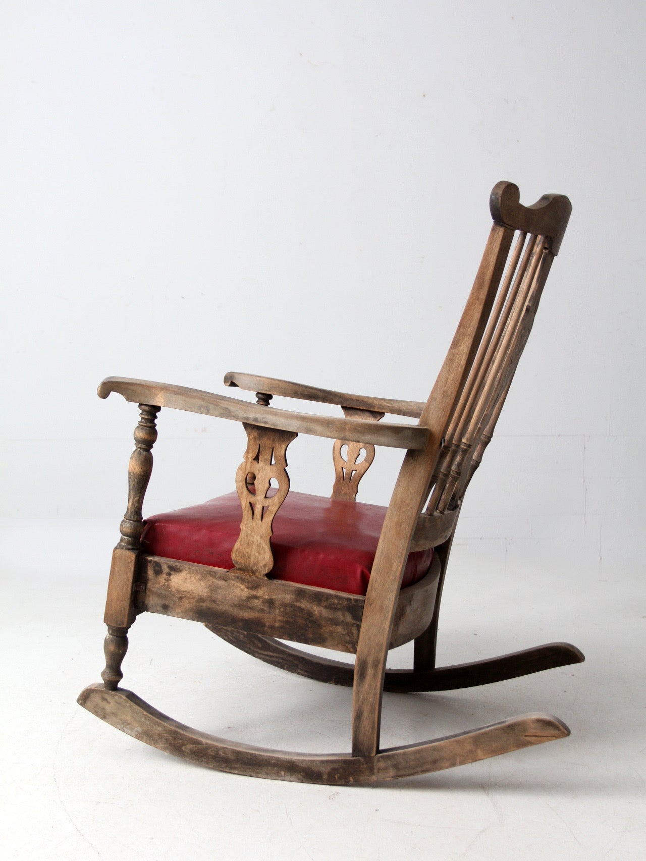 antique wooden rocking chair with upholstered seat