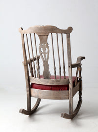 antique wooden rocking chair with upholstered seat