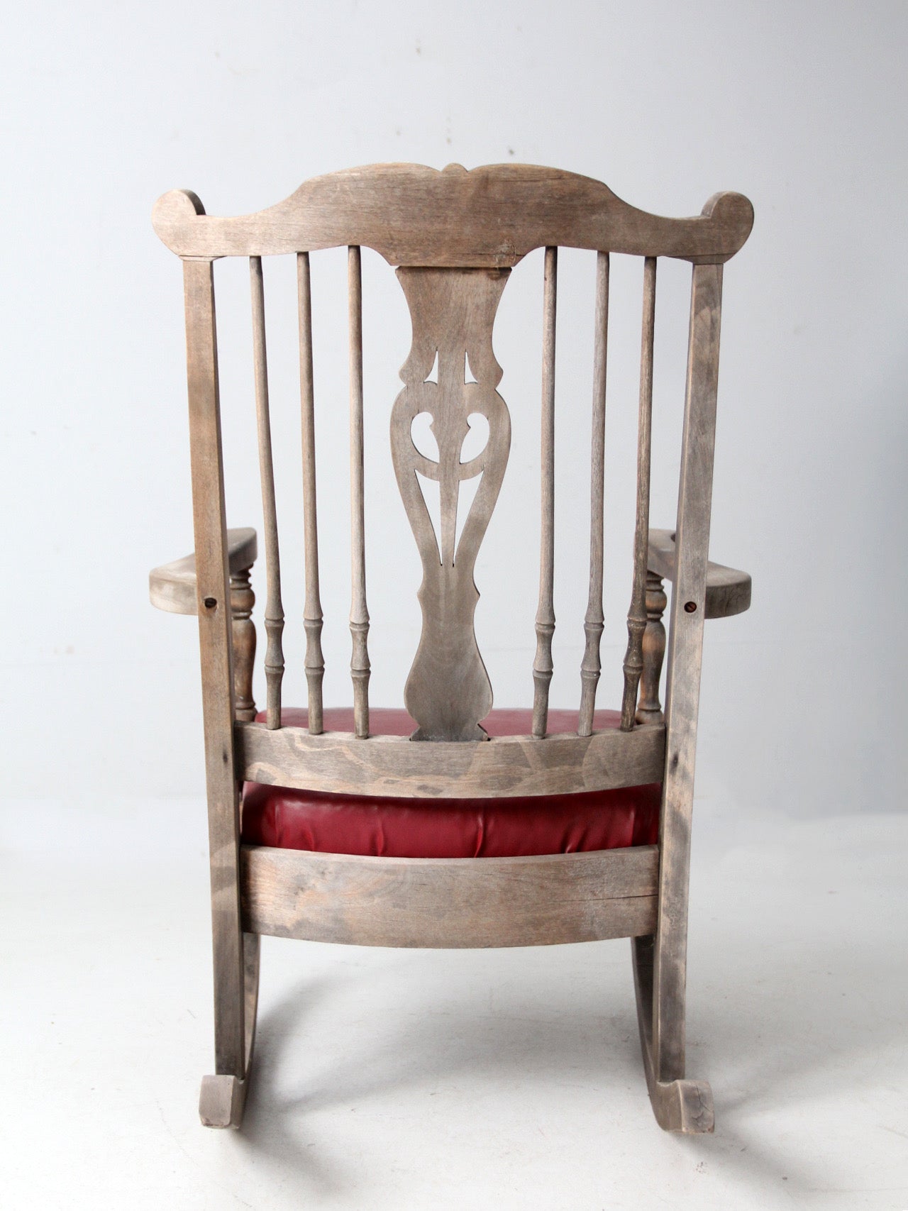 antique wooden rocking chair with upholstered seat