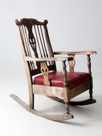 antique wooden rocking chair with upholstered seat