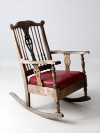 antique wooden rocking chair with upholstered seat