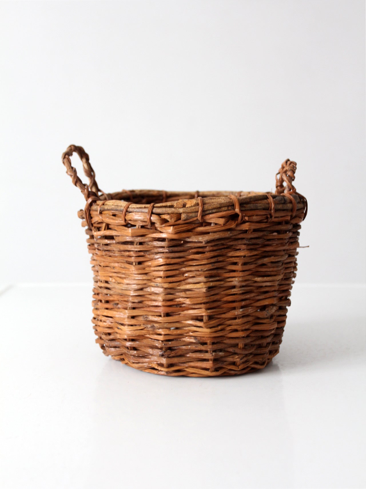 vintage handmade wicker basket with twisted handles