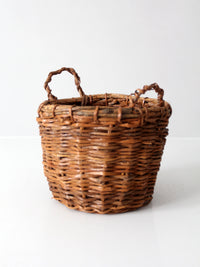 vintage handmade wicker basket with twisted handles