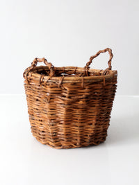 vintage handmade wicker basket with twisted handles