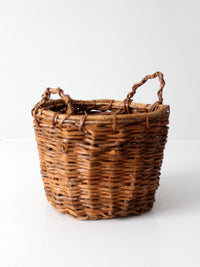 vintage handmade wicker basket with twisted handles
