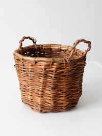 vintage handmade wicker basket with twisted handles