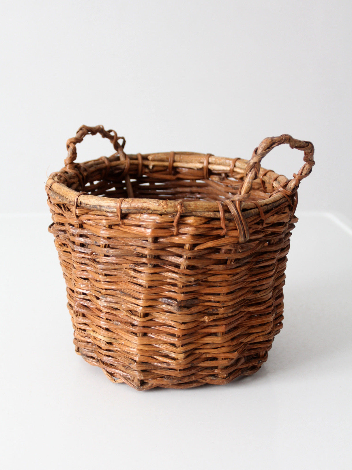 vintage handmade wicker basket with twisted handles