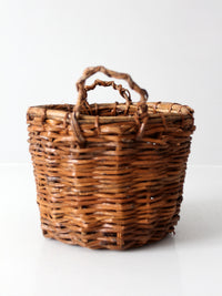 vintage handmade wicker basket with twisted handles