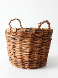 vintage handmade wicker basket with twisted handles