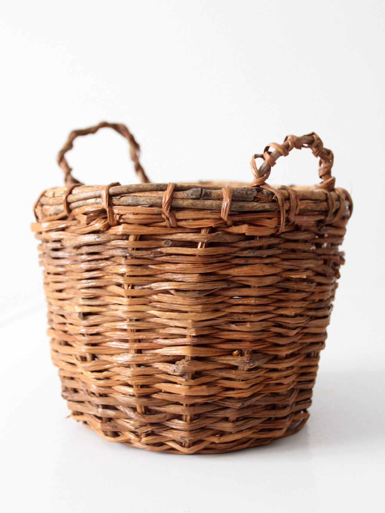 vintage handmade wicker basket with twisted handles
