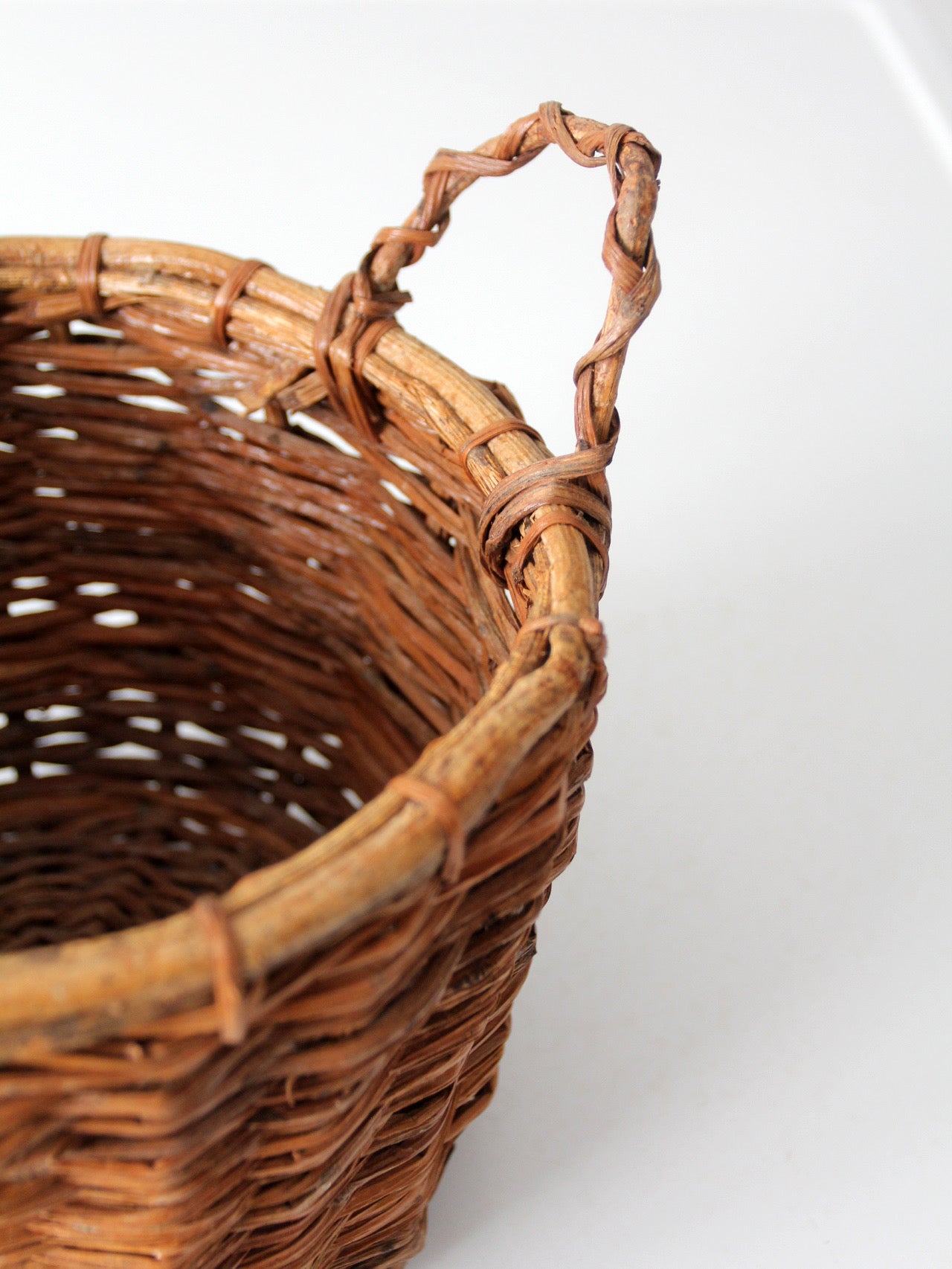 vintage handmade wicker basket with twisted handles