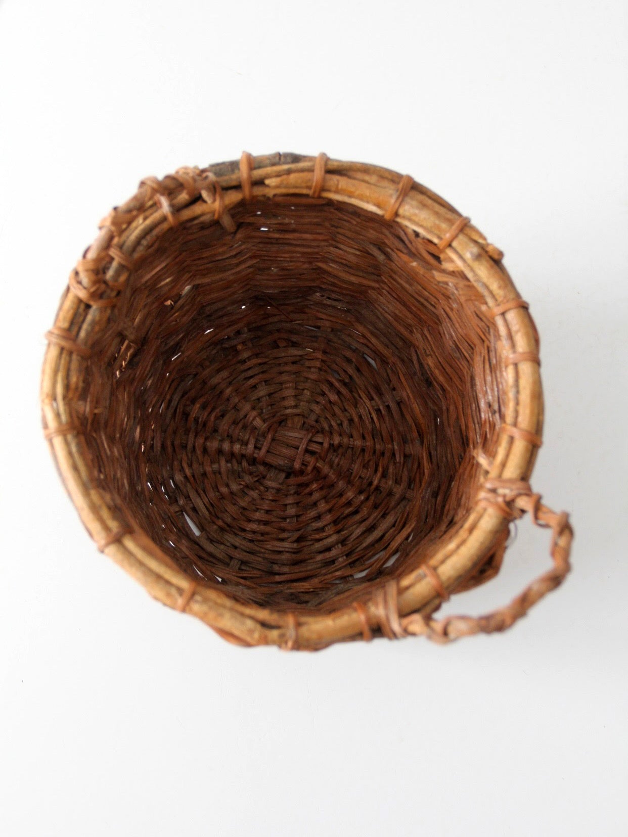 vintage handmade wicker basket with twisted handles