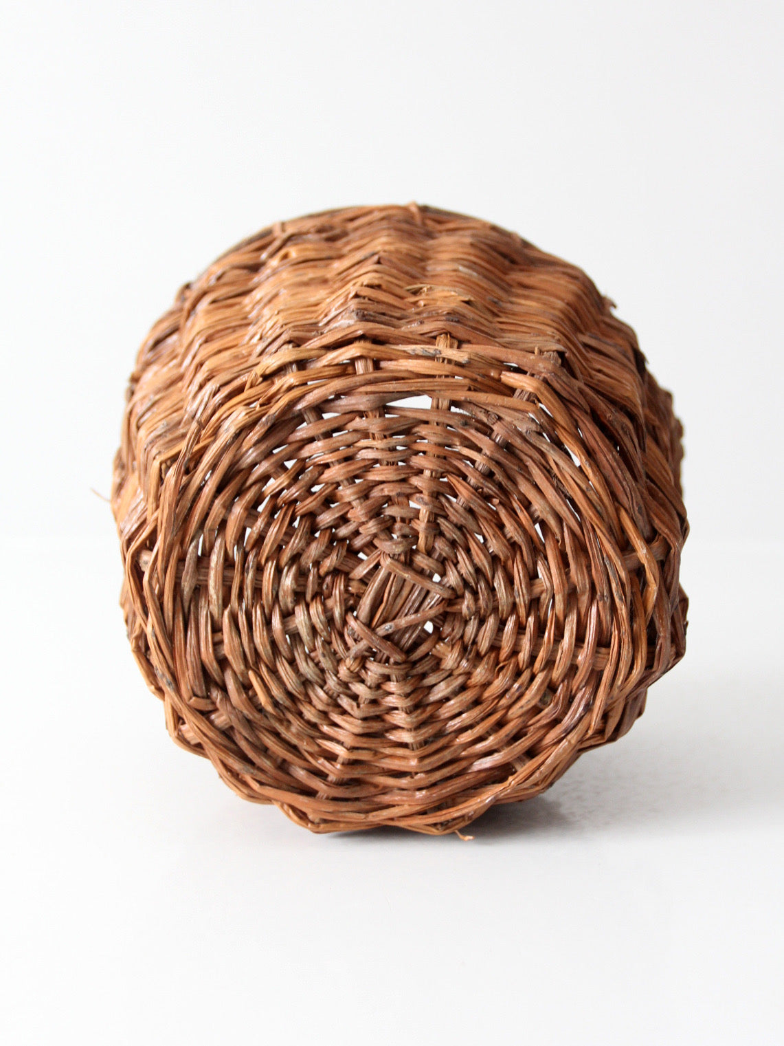 vintage handmade wicker basket with twisted handles