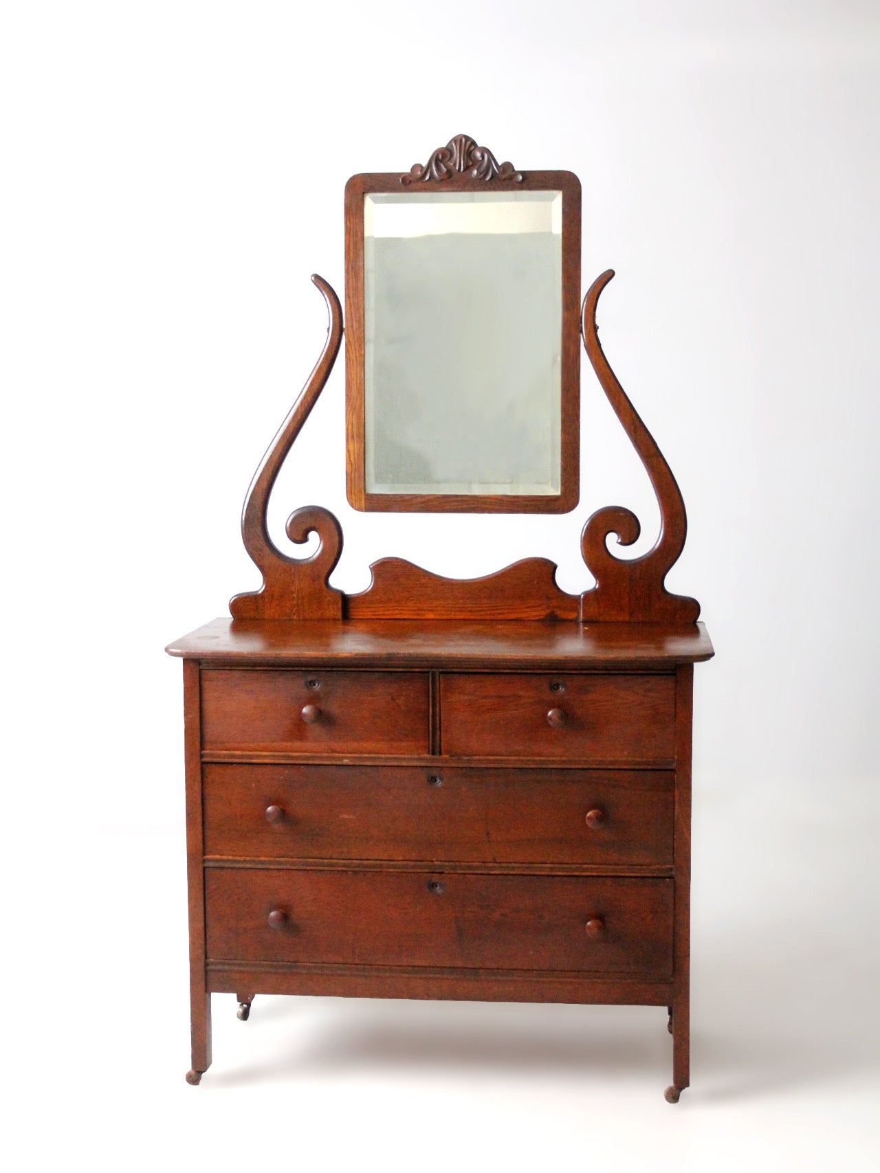 antique Victorian dresser with beveled glass mirror