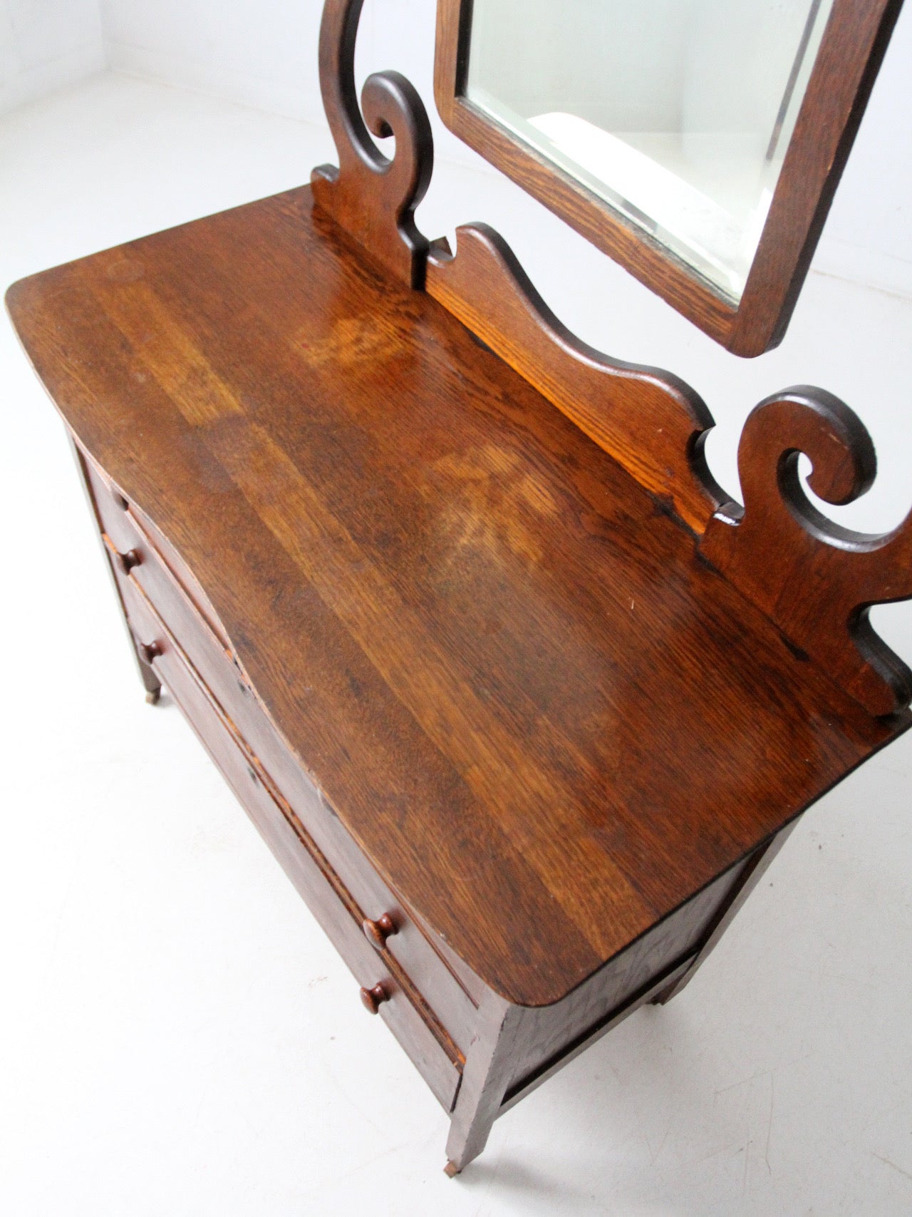 antique Victorian dresser with beveled glass mirror