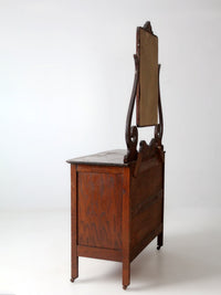 antique Victorian dresser with beveled glass mirror