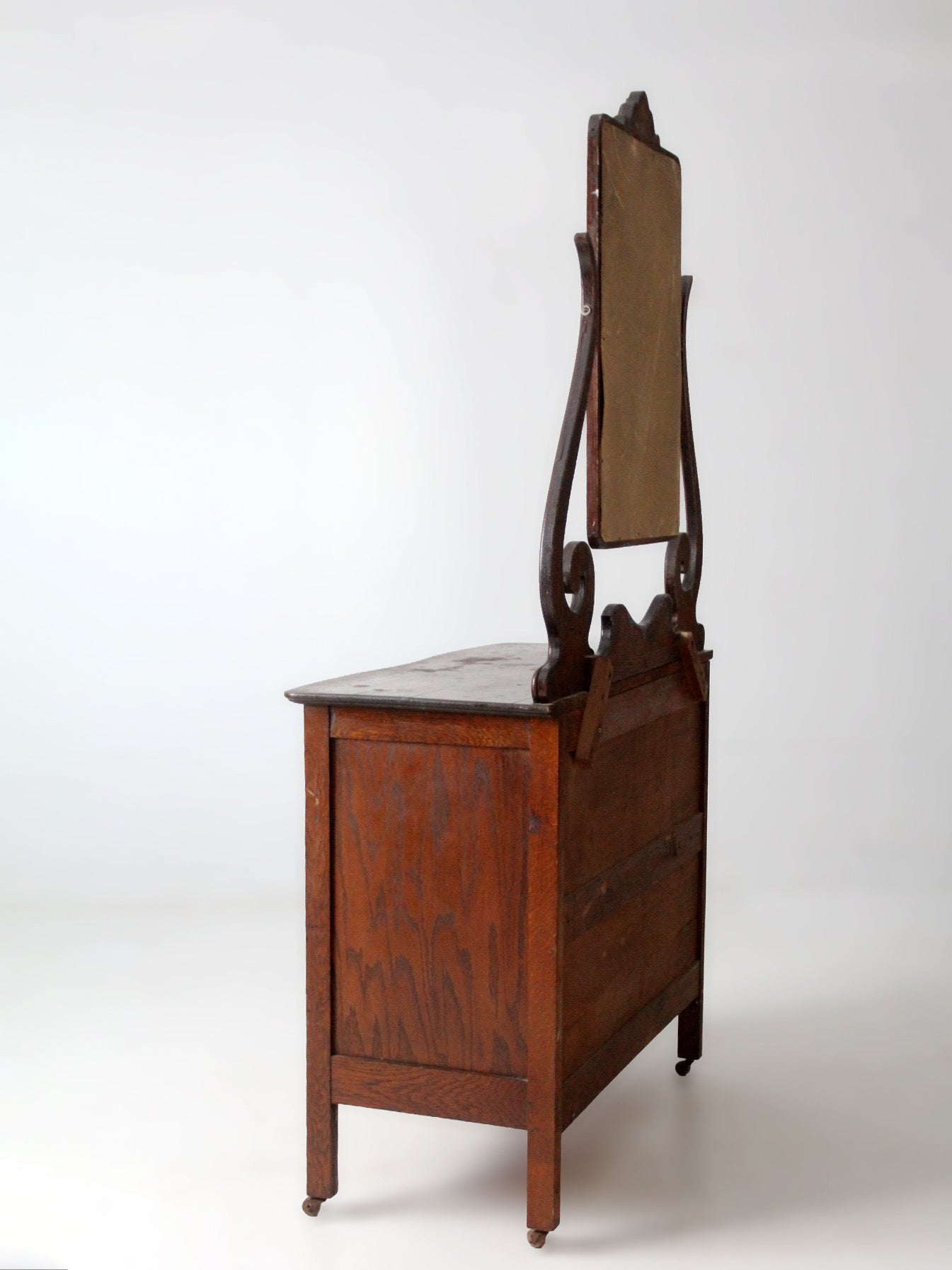 antique Victorian dresser with beveled glass mirror