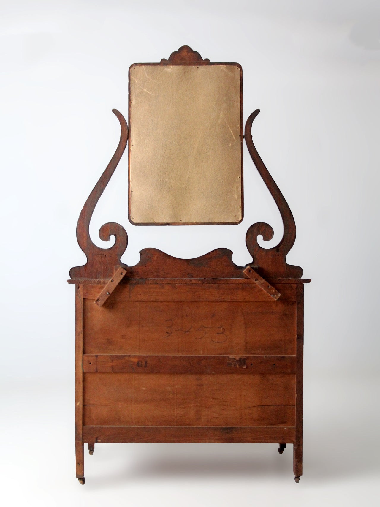 antique Victorian dresser with beveled glass mirror