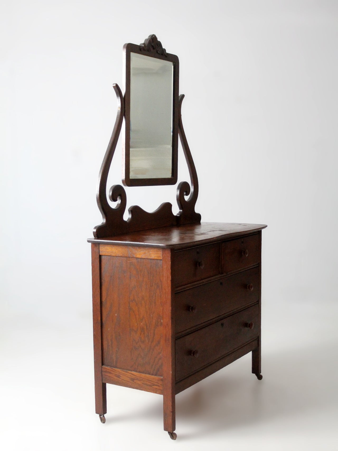 antique Victorian dresser with beveled glass mirror