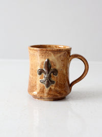 vintage studio pottery mug with fleur-di-lis