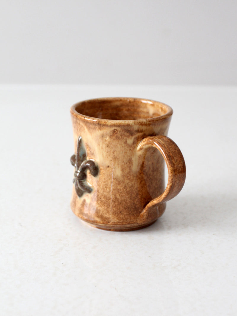 vintage studio pottery mug with fleur-di-lis