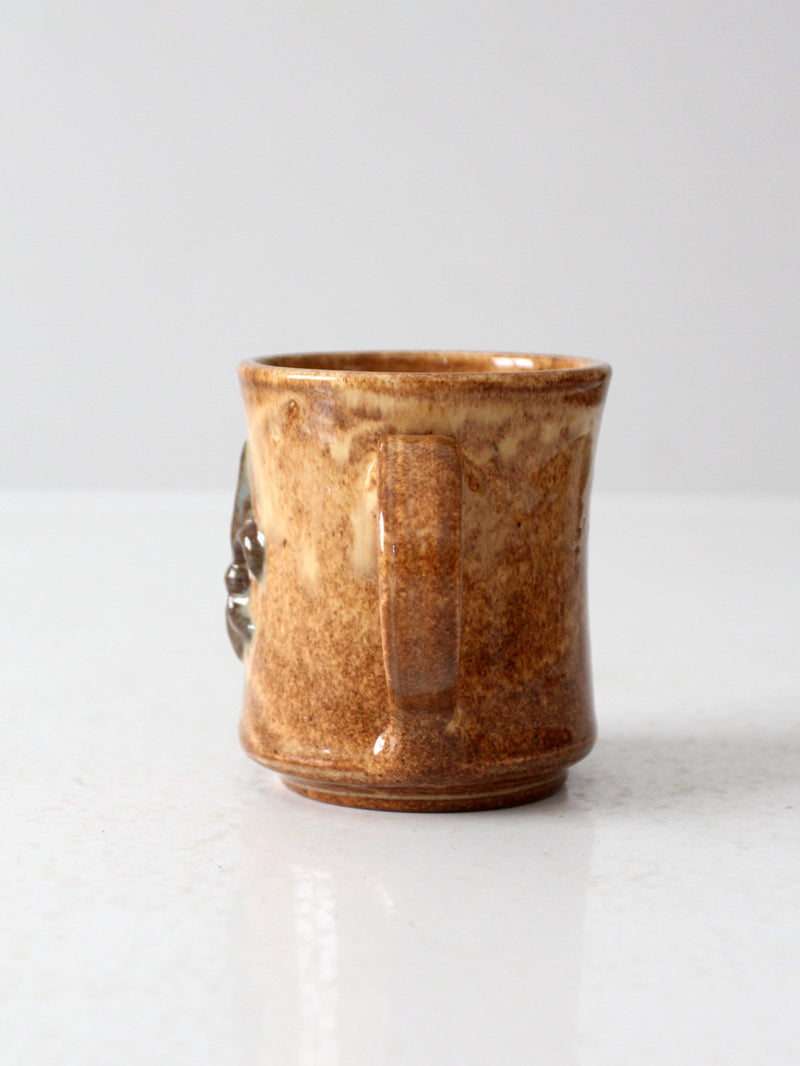 vintage studio pottery mug with fleur-di-lis