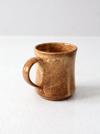 vintage studio pottery mug with fleur-di-lis