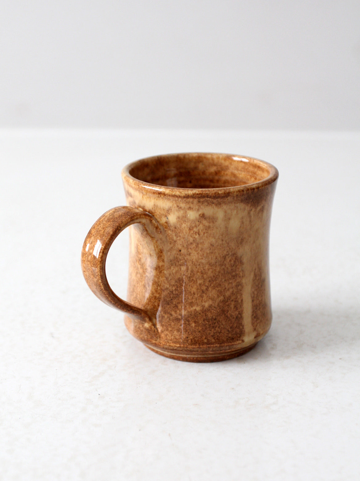 vintage studio pottery mug with fleur-di-lis