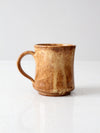 vintage studio pottery mug with fleur-di-lis