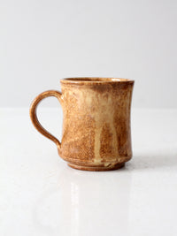 vintage studio pottery mug with fleur-di-lis