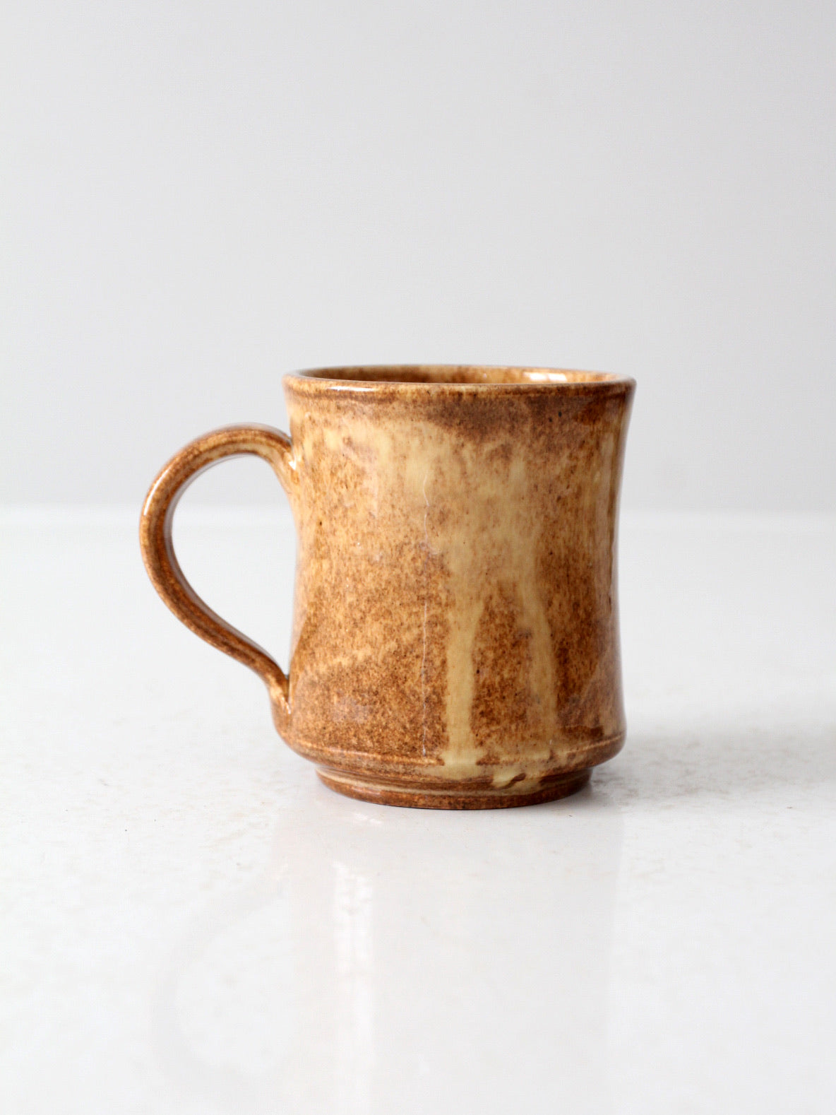 vintage studio pottery mug with fleur-di-lis