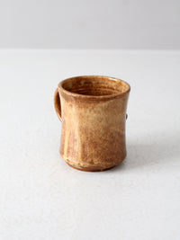 vintage studio pottery mug with fleur-di-lis