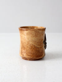 vintage studio pottery mug with fleur-di-lis