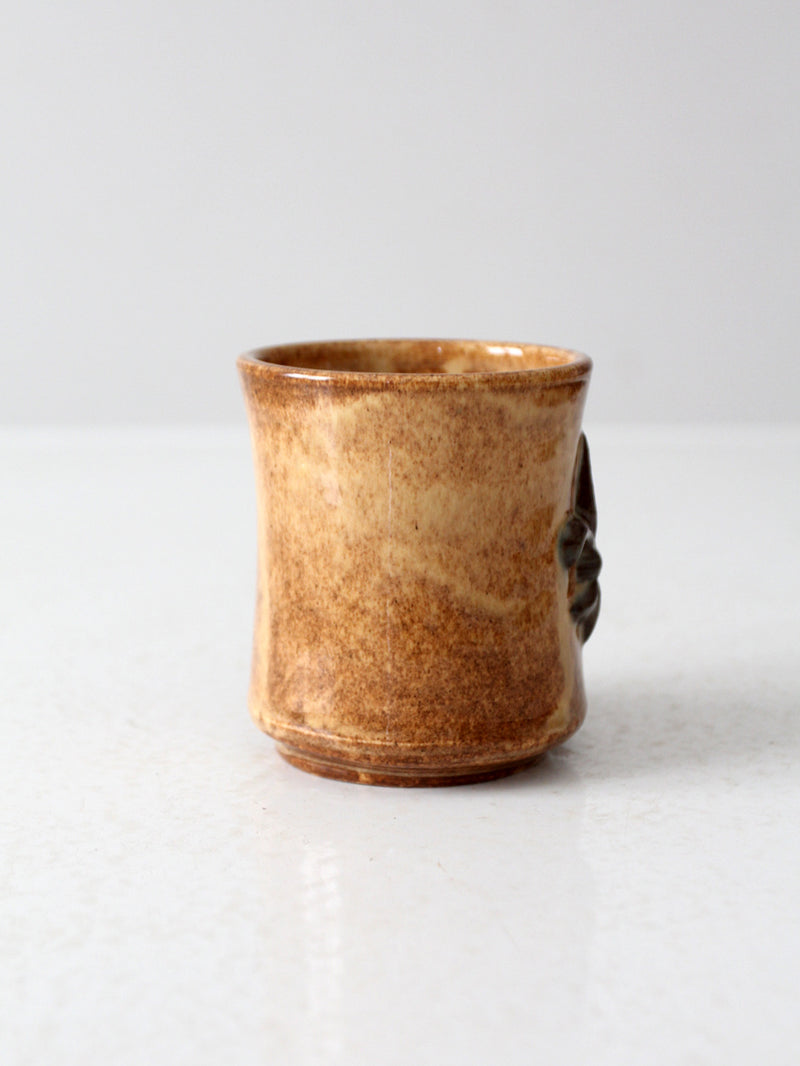 vintage studio pottery mug with fleur-di-lis