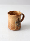 vintage studio pottery mug with fleur-di-lis