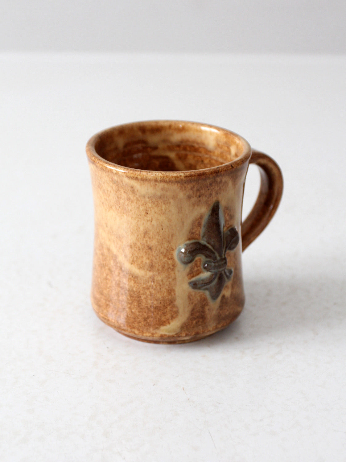 vintage studio pottery mug with fleur-di-lis