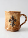 vintage studio pottery mug with fleur-di-lis
