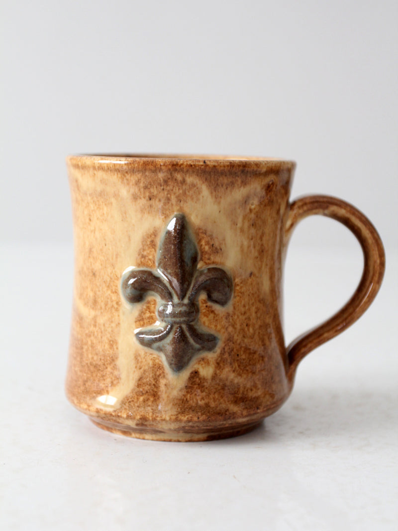 vintage studio pottery mug with fleur-di-lis