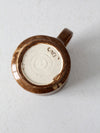 vintage studio pottery mug with fleur-di-lis