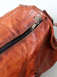 vintage brown leather duffle bag with shoulder strap
