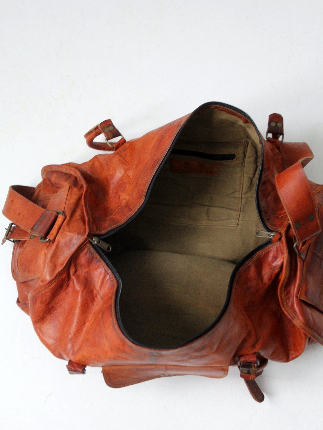 vintage brown leather duffle bag with shoulder strap